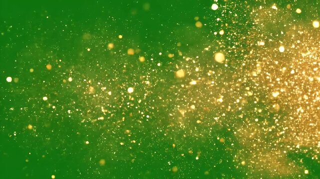 Gold glitter on green background - This video shows a cluster of golden glitter and sparkles on a bright green background.