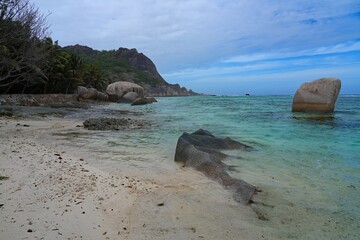 Day view of the Anse Source d Argent beach with its granite boulders on La Digue island in the Seychelles, one of the most beautiful beaches in the world