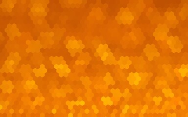 Abstract orange geometric background featuring a mosaic of hexagonal shapes with a soft bokeh effect and warm golden gradients.