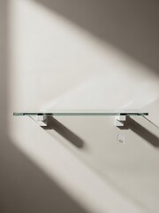 Minimalist glass shelf in soft light