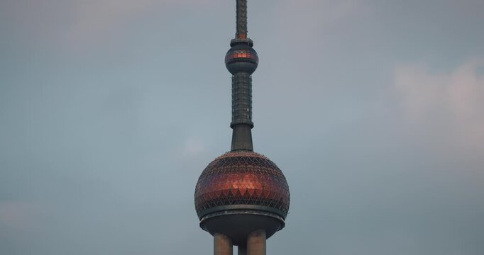 Shanghai, China. Oriental Pearl Tower rises alongside remarkable modern buildings. copy space time lapse
