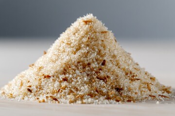 Granular mound, light tan mix of sugar and flakes