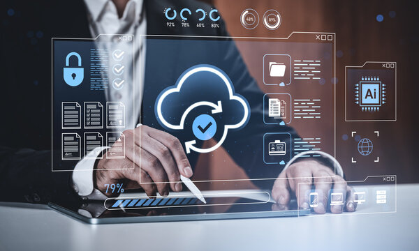 Businessman using tablet with holographic cloud computing interface and cybersecurity icons on futuristic background for data management concept. - Powered by Adobe