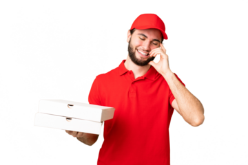pizza delivery man with work uniform picking up pizza boxes over isolated chroma key background laughing