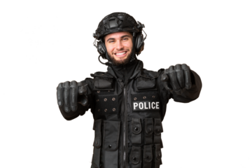 SWAT over isolated chroma key background points finger at you while smiling