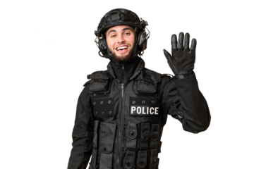 SWAT over isolated chroma key background saluting with hand with happy expression