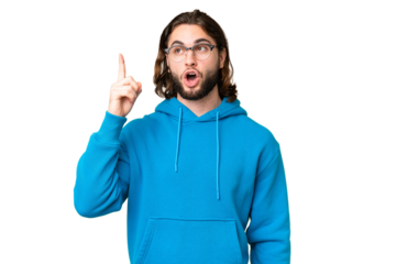 Young handsome man over isolated chroma key background thinking an idea pointing the finger up