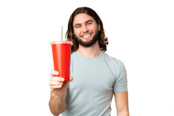 Young handsome man holding soda over isolated chroma key background with happy expression