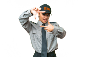 Young safeguard woman over isolated chroma key background focusing face. Framing symbol