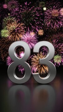 Silver number 83 with fireworks in the background. Festive scene for birthday or anniversary party