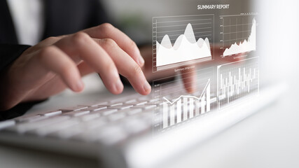 A business professional engages in data analysis using a laptop. Charts and graphs appear on the screen, showcasing performance metrics in a modern office environment. Impute