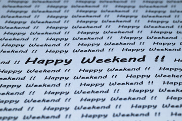 The words "Happy Weekend" are written on a piece of white paper.