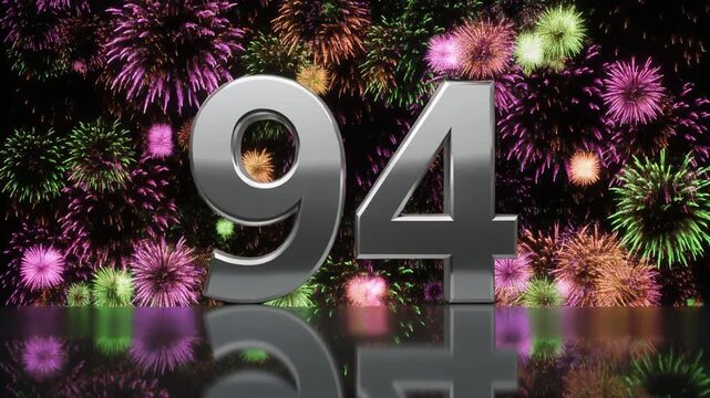 Silver number 94 with fireworks in the background. Festive scene for birthday or anniversary party