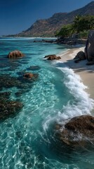 Fototapeta premium Crystal clear turquoise water, white sand, waves, and lush green hills