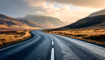 Winding Road Through Scenic Mountain Landscape at Sunset.