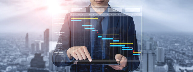 A business professional examines a project timeline on a tablet, showcasing data visualization against a modern city skyline, representing growth and strategic planning. Tessel