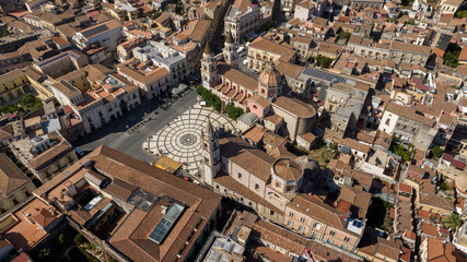 Obraz premium Aerial view of Piazza Duomo, located in the historic center of Acireale, in the province of Catania, Sicily, Italy. It is the most important square in the town with a decorative geometric design.
