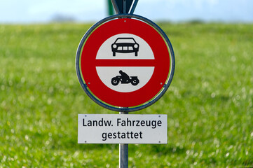 Close-up of traffic sign no motor vehicles allowed except agricultural vehicles at Swiss village of Niederglatt on a sunny autumn day. Photo taken December 20th, 2025, Niederglatt, Switzerland.
