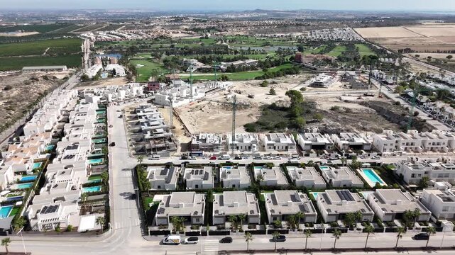 Orbit drone view of La Finca Golf resort residential development and surrounding infrastructure