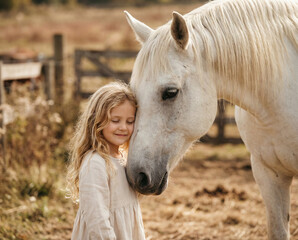Fototapeta premium Soft Emotional Portrait of Child and Horse Relationship