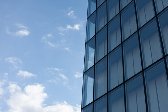 Modern architecture and cloudy blue sky on background