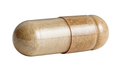 Close-up of beige pill capsule with textured contents