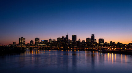 Fototapeta premium Blue hour city skyline silhouette with glowing lights