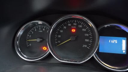 Video with sound. Dashboard Display Showing Speedometer and Warning Lights with Digital Readout Indicating Vehicle Status at Various Readings in a Modern Car Console - Powered by Adobe