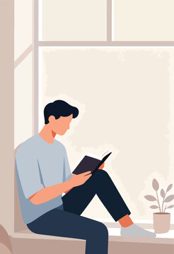 Young person sitting by large window reading a book