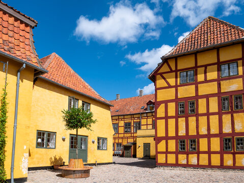 Andresens K&oslash;bmandsg&aring;rd merchant&rsquo;s yard with timber-framed yellow buildings, Kerteminde, Funen, Southern Denmark