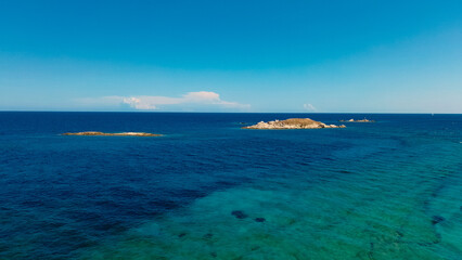 Aerial View of Aegean Sea with clear water seascape. View from drone shot of exotic water from Greece. Travelling concept.