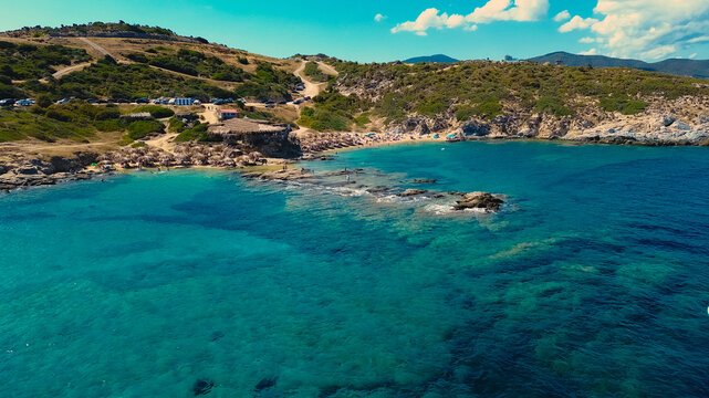 Amazing view of Sithonia coastline near Tigania Beach, Halkidiki in Greece. Coastline of Greek beach view and people on vacation.