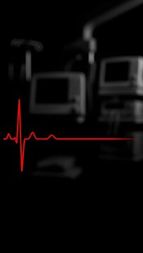 A dramatic, vertical format image showing a bright red ECG reading waveform tracing a normal heart rhythm (QRS complex) against a dark, black background, with blurred medical monitoring equipment vis