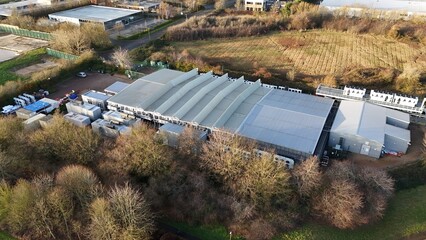 Aerial drone view of large scale cutting-edge technology and futuristic infrastructure of a large-scale data center in Milton Keynes, UK. AI cloud quantum computing. 
