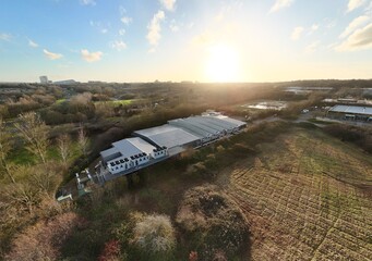 Aerial drone view of large scale cutting-edge technology and futuristic infrastructure of a large-scale data center in Milton Keynes, UK. AI cloud quantum computing. 