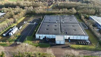 Aerial drone view of large scale cutting-edge technology and futuristic infrastructure of a large-scale data center in Milton Keynes, UK. AI cloud quantum computing.