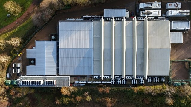 Aerial drone view of large scale cutting-edge technology and futuristic infrastructure of a large-scale data center in Milton Keynes, UK. AI cloud quantum computing. 
