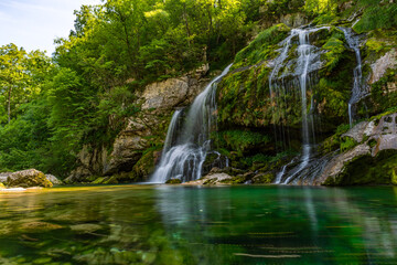 Fototapeta premium Serene Virje Waterfall in Soca Valley Triglav National Park Slovenia Natural Beauty
