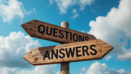 Wooden directional signpost with Questions and Answers text against a bright blue sky; ideal for navigation, problem-solving, and guidance concepts.
