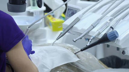 Modern dental equipment and instruments during patient treatment