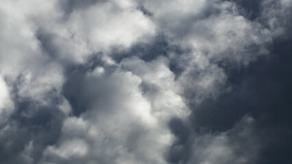 Calm blue sky with clouds of different shapes, background image