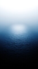 Ocean surface with reflecting light creates a serene blue gradient