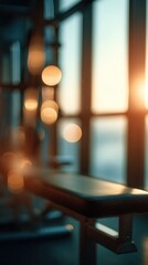 Gym bench against a blurry background with warm bokeh lights from a window