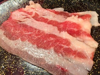 A dish of Shabu shabu sliced meat; beef and pork. Japanese traditional meal; Sukiyaki main ingredient. Japan restaurant product
