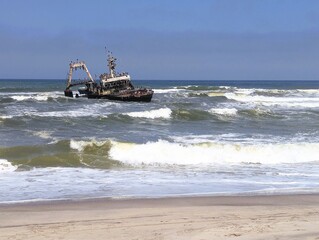 Photograph of the Zeila wreck, a stranded fishing boat on the Skeleton Coast near Namibia in the Atlantic Ocean. 