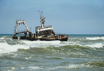 Photograph of the Zeila wreck, a stranded fishing boat on the Skeleton Coast near Namibia in the Atlantic Ocean. 