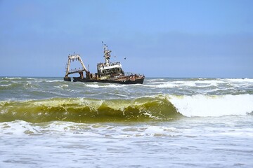 Photograph of the Zeila wreck, a stranded fishing boat on the Skeleton Coast near Namibia in the Atlantic Ocean. 