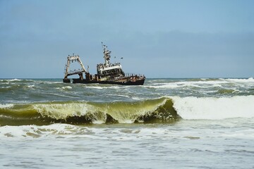 Photograph of the Zeila wreck, a stranded fishing boat on the Skeleton Coast near Namibia in the Atlantic Ocean. 