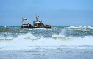 Photograph of the Zeila wreck, a stranded fishing boat on the Skeleton Coast near Namibia in the Atlantic Ocean. 