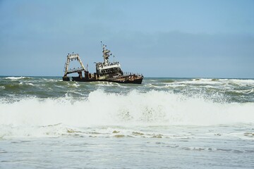 Photograph of the Zeila wreck, a stranded fishing boat on the Skeleton Coast near Namibia in the Atlantic Ocean. 